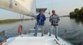 Two male sailors on deck of sailing yacht, friends, vacation Video