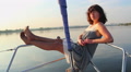 Attractive woman having rest on sailboat, vacation, holiday Video