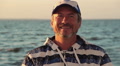 Portrait of senior happy man on sailing boat, emotions, joy Video
