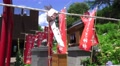 Prayer Scroll Tied To Rope In Front Of Flags At Shinto Shrine 4K Video