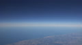 Aeroplane window seat view with clean blue sky Video