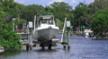 Boat Of Dock Lift On Florida River With Trees Video