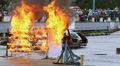 Car with stuntman on hood crashes into fire wall, sequence Video