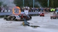 Stuntman performs double jump through fire circles, multi-angle Video