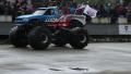 Huge monster truck circling at arena, crushing junk cars, show Video