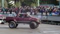 Bigfoot pulling another monster truck, sporting event, show Video