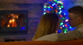 The lovers talk, laugh and kiss in the house by the fireplace Video