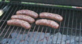 Sausage cooking on the grill Clip 2 Footage