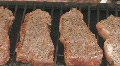Steaks cooking on charcoal grill clip 4 Footage
