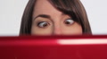 Woman at computer. Crossed eyes. Footage