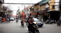 Streets of Hanoi in a busy day, Motocycles and cars traffic in Old Town, Vietnam Footage