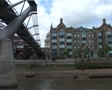 Passing Millenium Bridge and St Pauls on Gloomy Day, London England GFSD Footage