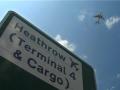 London Heathrow sign with Plane Overhead, London England GFSD Footage
