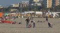 Family relaxing and walking on the sandy beach, Rimini, Italy, Footage