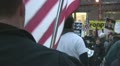 American Flag holder at Iraq War protest Footage