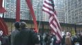 American Flag holder at Iraq War protest in Federal Plaza - Chicago, IL Footage