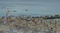 People relaxing on the beach Footage