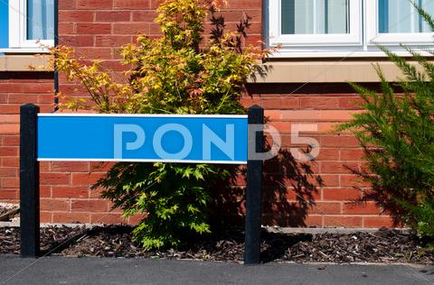 Stock photo of real estate sign and house