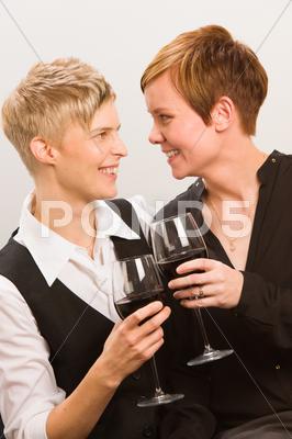 Stock photo of lesbians and red wine