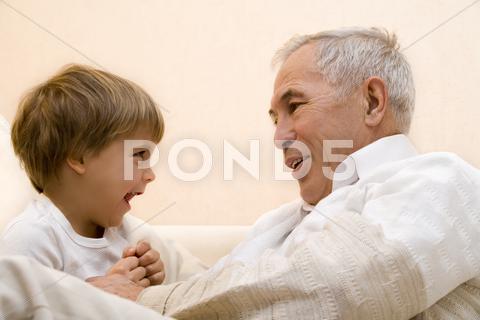 Stock photo of Adult senior with his grandchild