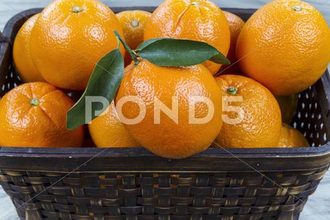 Stock photo of basket of fresh oranges
