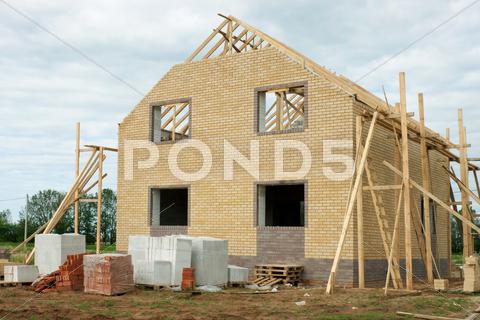 Stock photo of brick house under construction