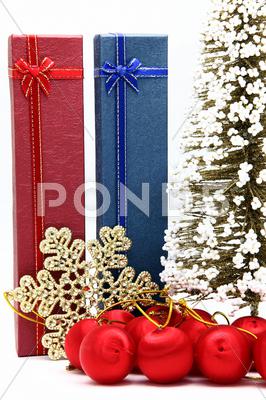 Stock photo of red and blue holiday box with christmas tree and ornament