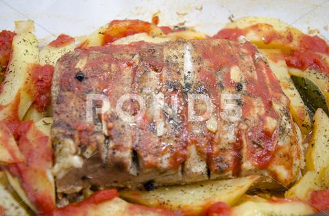 Stock photo of Food - Pork steak with baked potatoes and spices