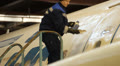 Service Utair aircraft in the hangar. Repair. Airport Footage