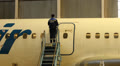Service Utair aircraft in the hangar. Repair. Airport Footage