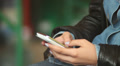 Hands typing sms messages touch phone, female fingers, public Footage