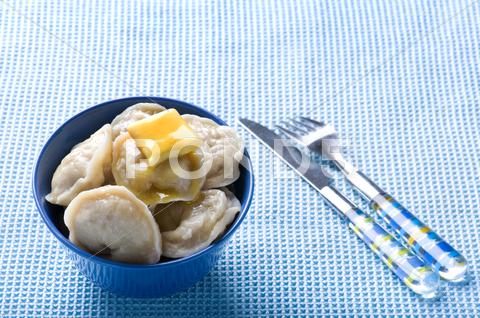 Stock photo of ravioli on blue