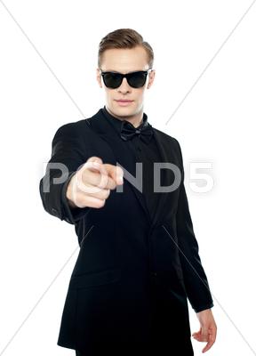 Stock photo of Handsome man indicating towards you