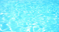 Blue Water Ripples Fastly in Swimming Pool under Bright Sun. Speed up. Video