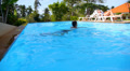 Attractive Couple Flirting and Smiling near Hotel Swimming Pool. Video
