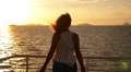 Freedom and Serenity Concept. Woman Embracing the Sun. Slow Motion. Video