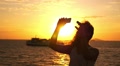 Beautiful Woman Taking Selfie against Sunset during Sea Cruise. Slow Motion. Video