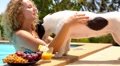 Cute Dog Kissing a Young Cheerful Woman at Summer Poolside. Video