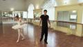 Man and woman rehearse ballet moves, take break from dancing Video