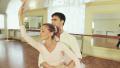 Young male and elderly female practicing ballet moves in studio Video