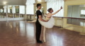 Male and female ballet dancers exercising in gym, slow motion Video