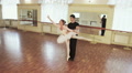 Couple practicing ballet dancing in front of mirrors, slow-mo Video