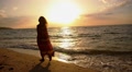 Free Happy Romantic Woman Walking on Beach at Sunset. Slow Motion. Video