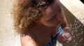 Close-up of Beautiful Wet Woman Face under Shower. Slow Motion. Video
