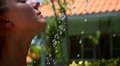 Attractive Female Taking Shower Outdoors. Slow Motion. Video