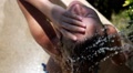 Beautiful Woman in Outdoor Shower. Slow Motion. Video