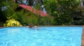 Young Woman in the Swimming Pool. Slow Motion. Video
