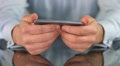 Male hands playing game on smart phone, fingers touching screen Footage