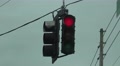 Red Stop Light Swinging In The Wind On Cloudy Day Footage